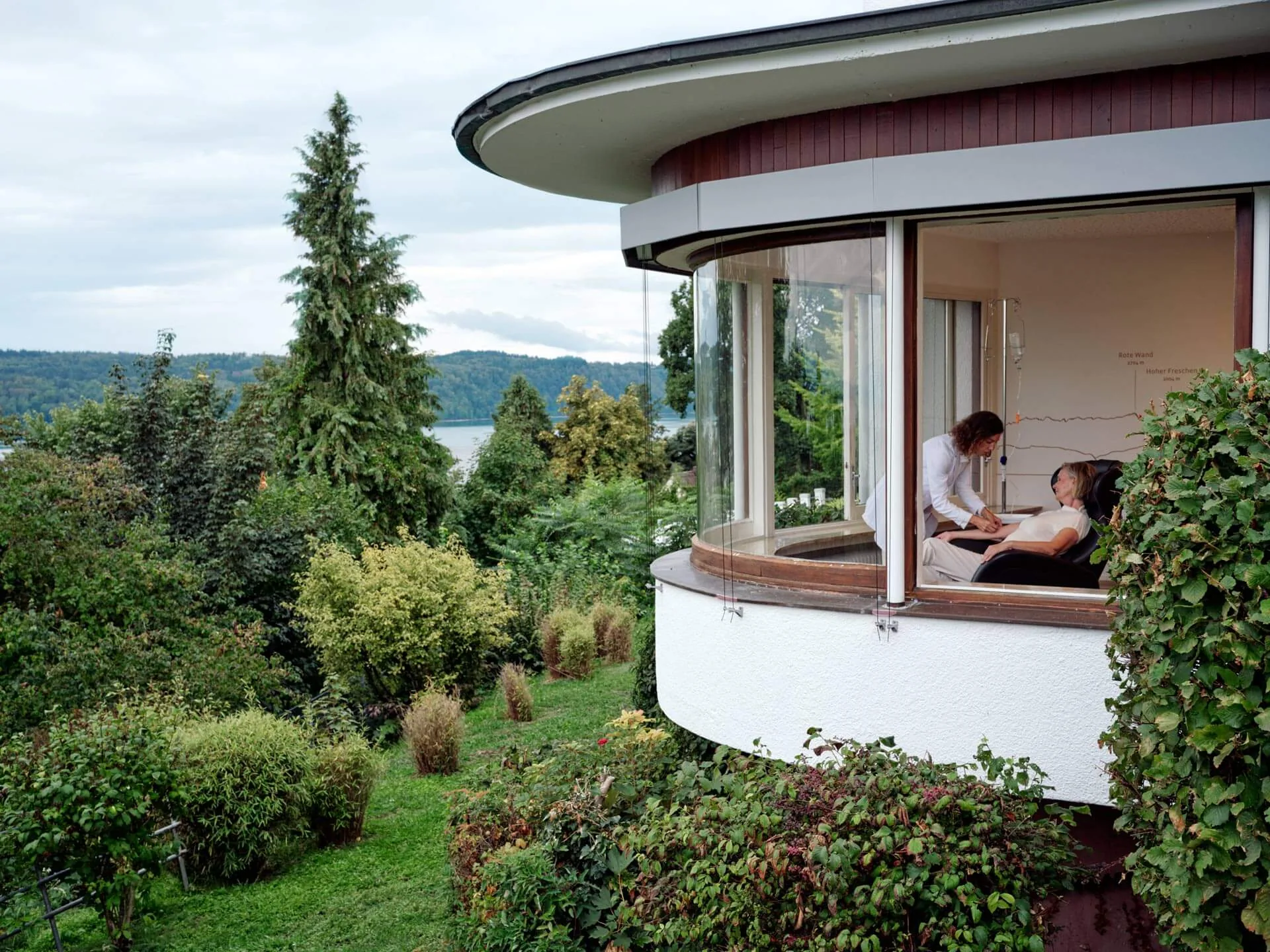 Round Buchinger Wilhelmi pavilion with panoramic windows, a patient resting during a treatment inside